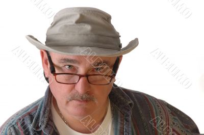 Middle-aged man with glasses and a hat