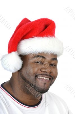 young smiling African American man with santa hat