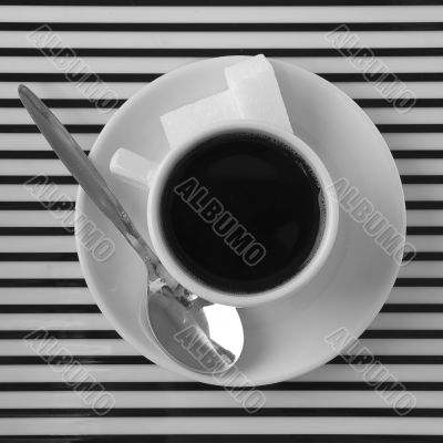 Coffee cup on the striped surface