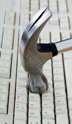 Metal hammer on keyboard