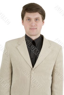 Portrait of young businessman in beige suit