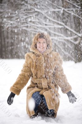 woman with snow in park