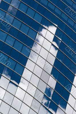 Skyscraper facade with clouds