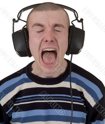 Young man in earphones loudly sings