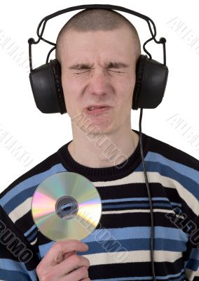 The young guy with ear-phones and a compact disk