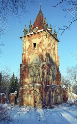 Old tower in snow park Old tower in snow park