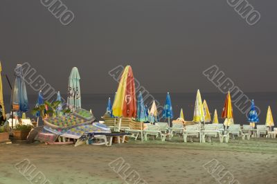 Night beach, umbrellas