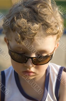 Boy in sun glasses closeup