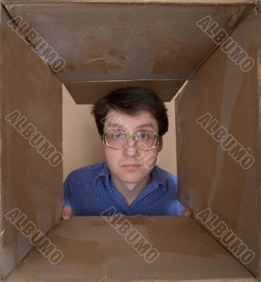 Man portrait inside carton box