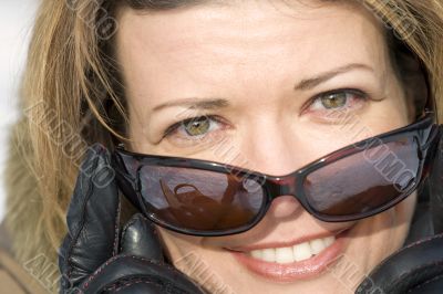 Woman in sun glasses close up
