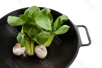 Bok Choy Stalks and Garlic in a Wok