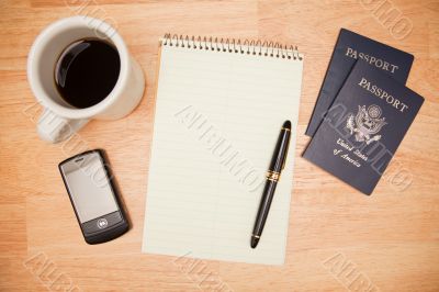 Overhead Pad, Pen, Passports, Coffee and Cell Phone