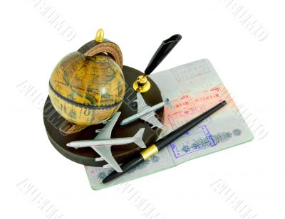 Passport with stamps, pen, globe and airplanes