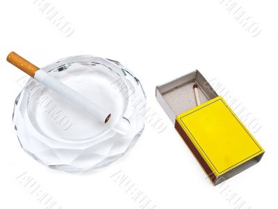 ashtray, cigarette and match
