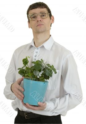 Man in spectacles with window plant in flowerpot