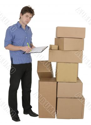 Man with marker and pile cardboard boxes