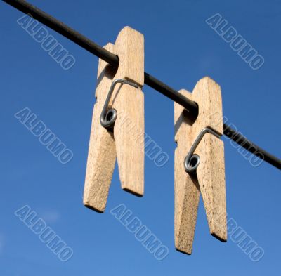 Two wooden clothes-peg