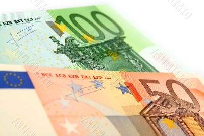 a few euro bills on a white background