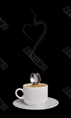 Two spoons embrace in a cup coffee