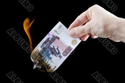 burning paper currency close up