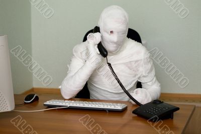 Businessman mummy with telephone
