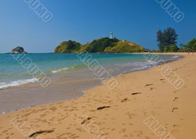 Pair of footprints on a tropical beach