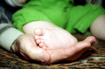 Infant foot and hand fingers with cracknel Infant foot and hand fingers with cracknel