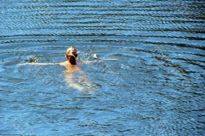 single female figure in wide water surface