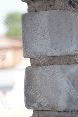 Grey brickwork construction on the background