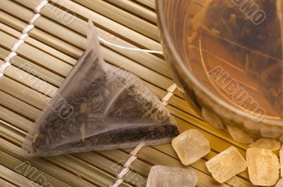 white tea, nylon tea-bag and sugar