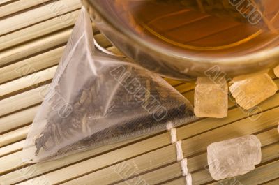white tea, nylon tea-bag and sugar