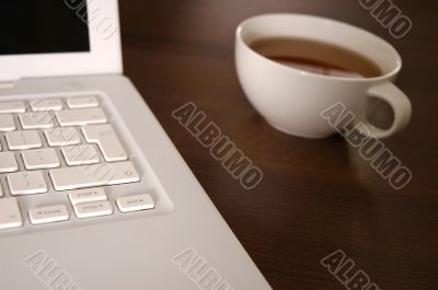 laptop and tea cup