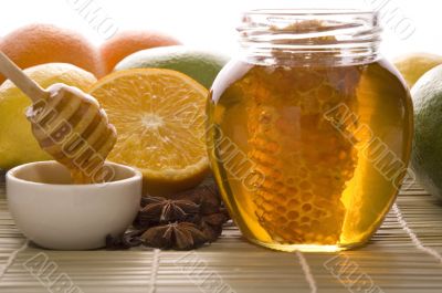 fresh honey with honeycomb, spices and fruits fresh honey with honeycomb, spices and fruits