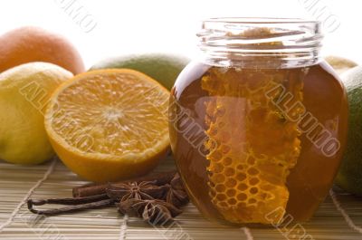 fresh honey with honeycomb, spices and fruits