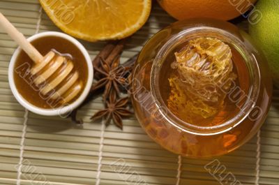 fresh honey with honeycomb, spices and fruits