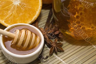 fresh honey with honeycomb, spices and fruits