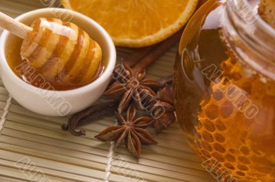 fresh honey with honeycomb, spices and fruits