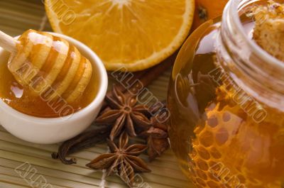 fresh honey with honeycomb, spices and fruits