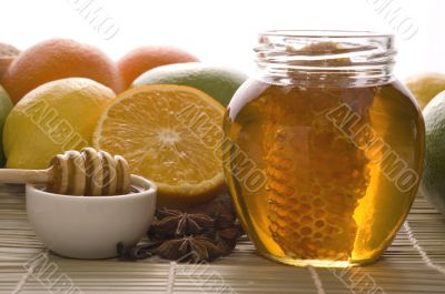 fresh honey with honeycomb, spices and fruits