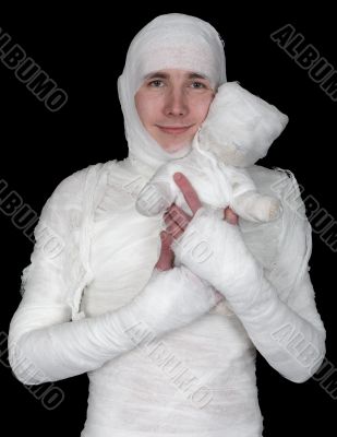 Sentimental man in bandage with mummy bear