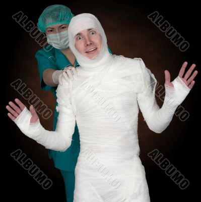 Man in bandage and nurse