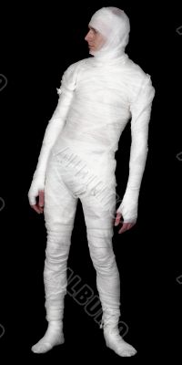 Guy in bandage upright on a black