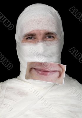 Guy in bandage with a false smile