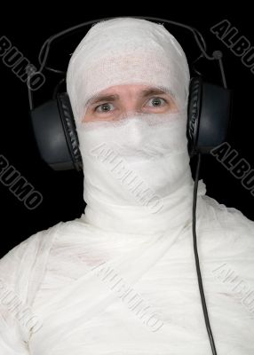 Man in bandage with ear-phones