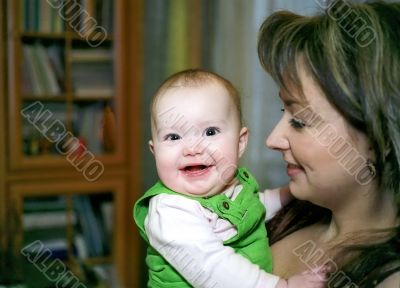 Laughing infant and mother