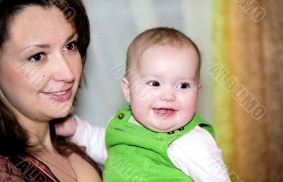 Smiling mother and her infant