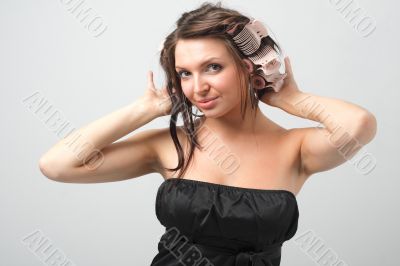 girl in hair curlers