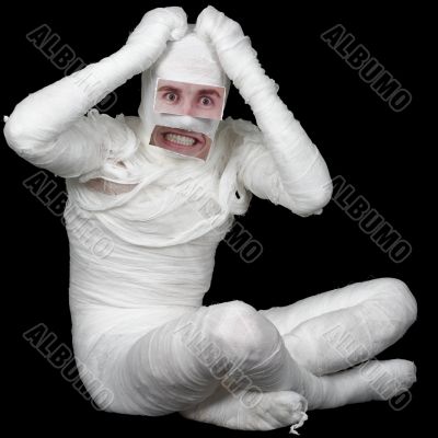 Man in bandage with false eyes and mouth