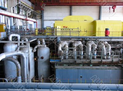 Steam turbine at a power plant with tubes and machinery