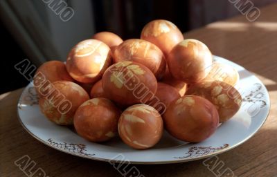 Painted pasch-eggs on the plate Painted pasch-eggs on the plate